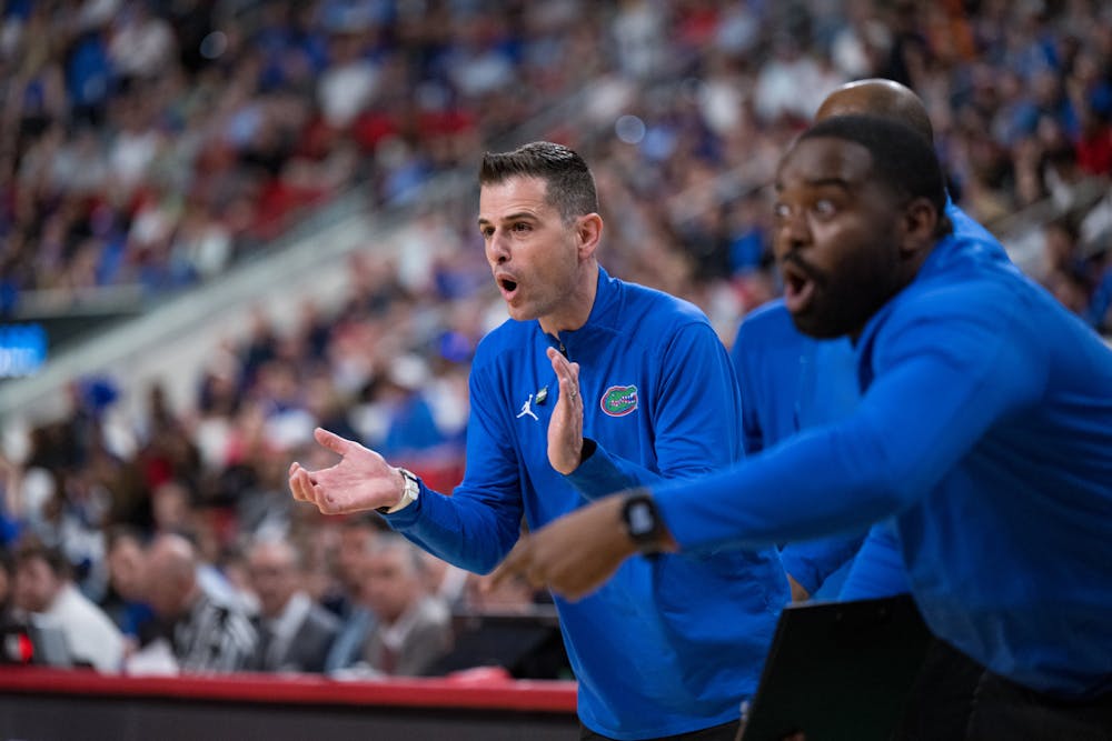 <p>Florida Gators head coach Todd Golden encourages his team during a basketball game against UConn in the second round of the NCAA Tournament on Sunday, March 23, 2025, in Raleigh, N.C.</p>