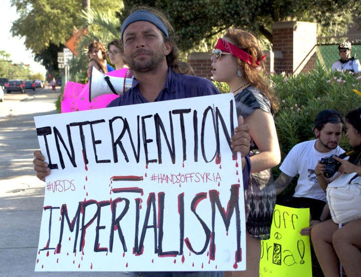 UF Students for a Democratic Society protest the United States’ intervention in Syria. Obama addressed the nation Tuesday night and called for diplomacy but left options open for military action.
