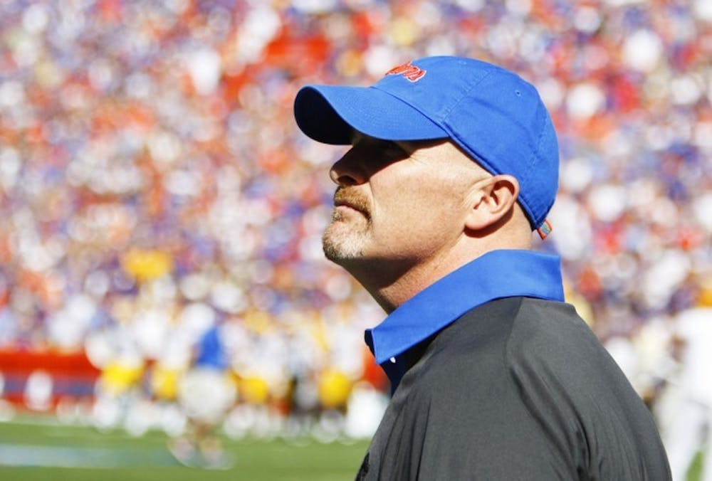 <p>Defensive coordinator Dan Quinn looks on during Florida’s 14-6 win against LSU on Oct. 6 at Ben Hill Griffin Stadium. Quinn and coach Will Muschamp have put an emphasis on forcing turnovers.&nbsp;</p>