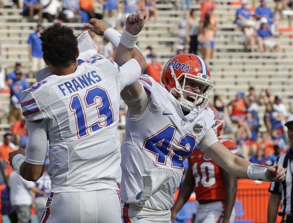 Florida quarterback Feleipe Franks cracks columnist Andrew Huang's top-five touchdown celebrations list during Saturday's Orange and Blue Game.