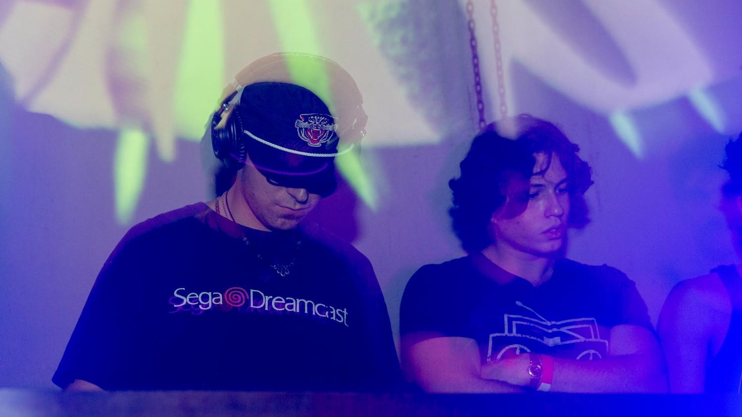 Two people DJ at Swamp Records and Strike Magazine Gainesville collaboration show “Tempo,” which showcased electronic music.