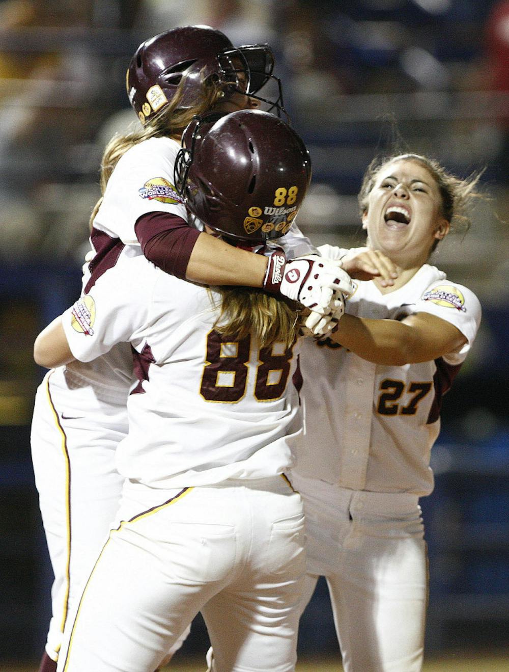 Arizona State's Katelyn Boyd, left, Kaylyn Castillo, right, and Annie Lockwood (88) celebrate following the Sun Devils walk-off victory over the Gators on Friday at ASA Hall of Fame Stadium in Oklahoma City. ASU trumped UF 6-5 on Day 2 of the WCWS, sending the Sun Devils into the semifinals.