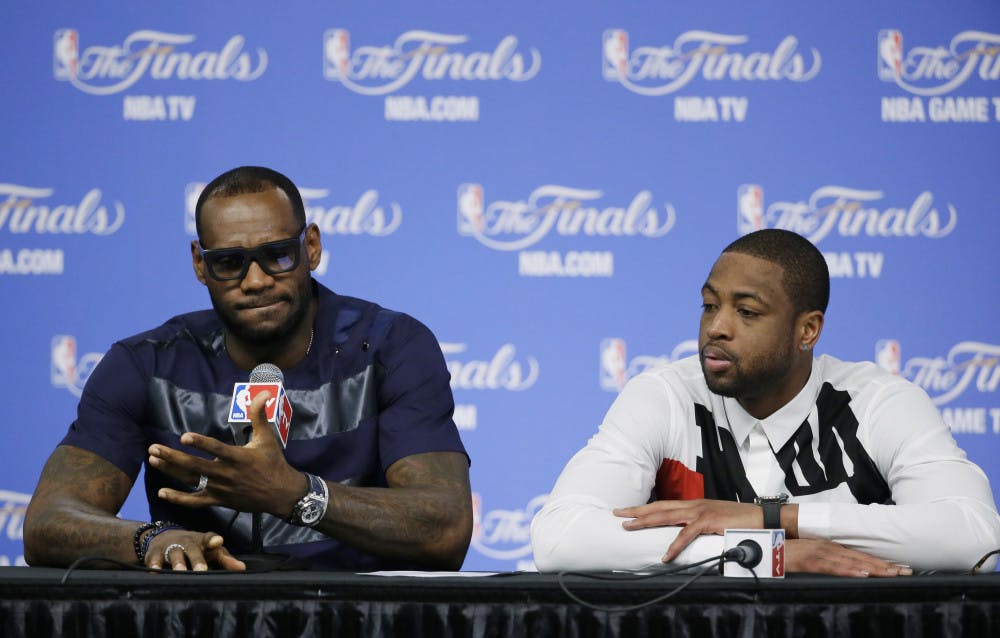 <p>LeBron James, left, and Dwyane Wade speak to the media after the Miami Heat’s 104-87 loss to the San Antonio Spurs in Game 5 of the NBA finals on Sunday night.</p>
