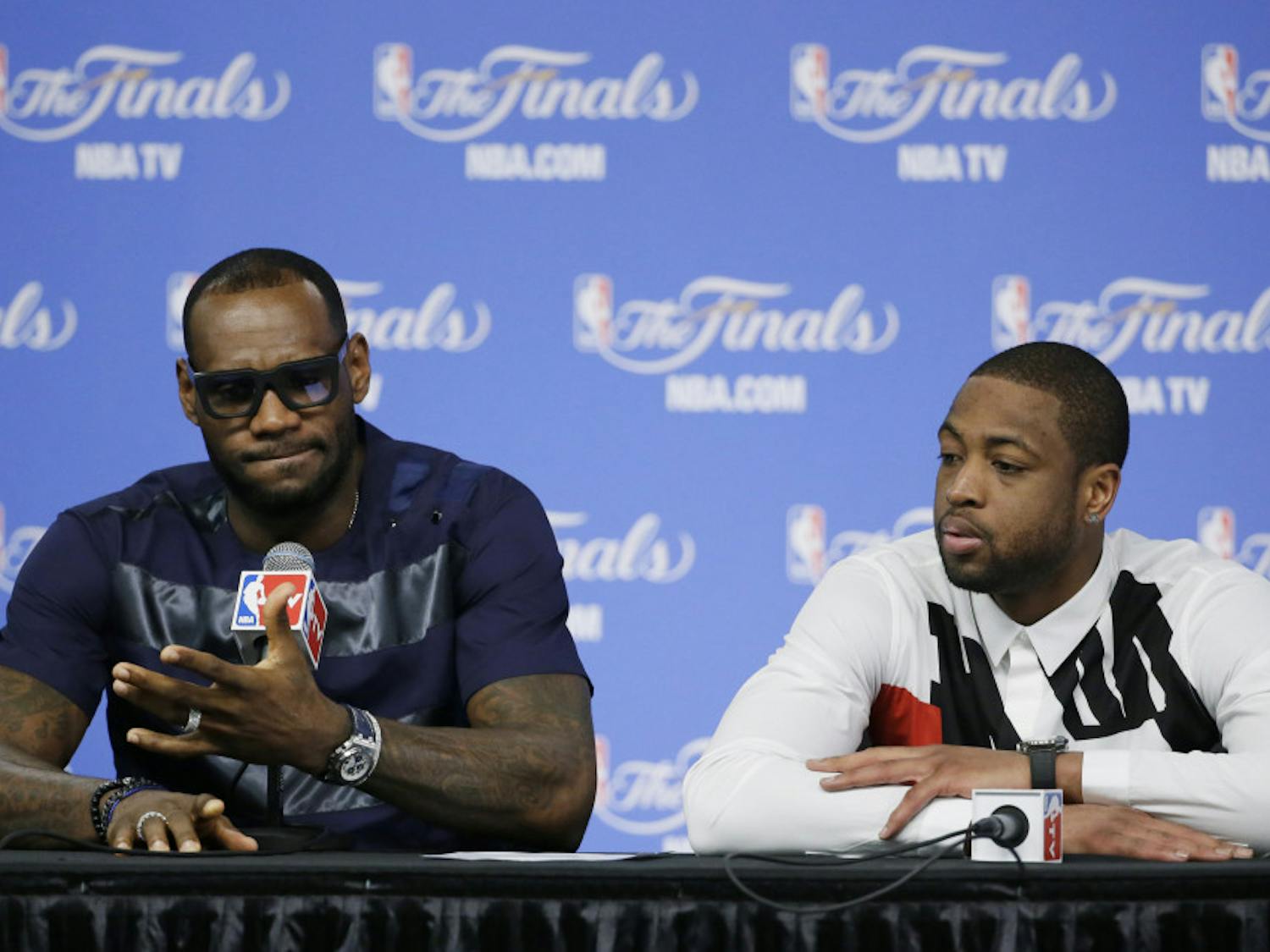 LeBron James, left, and Dwyane Wade speak to the media after the Miami Heat’s 104-87 loss to the San Antonio Spurs in Game 5 of the NBA finals on Sunday night.