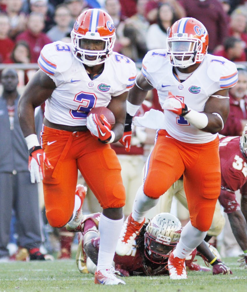 Jelani Jenkins (3) returns an interception during Florida’s 37-26 win against Florida State on Nov. 24 at Doak Campbell Stadium. Jenkins was one of three former Gators chosen by the Miami Dolphins on Friday. 