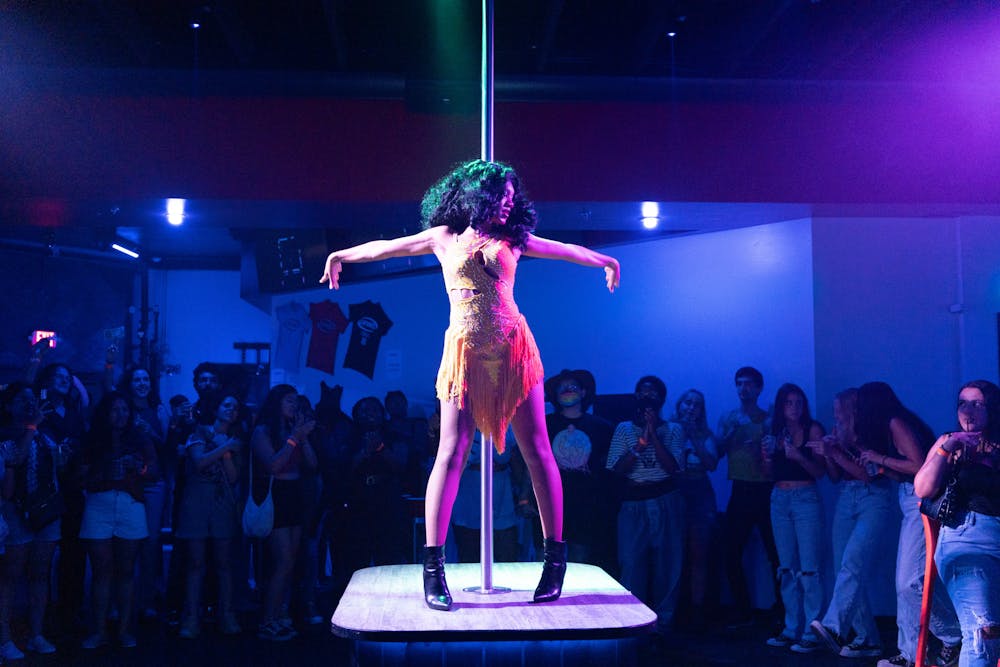 A drag queen performs as a crowd looks on at Capones on Friday, July 5, 2024.