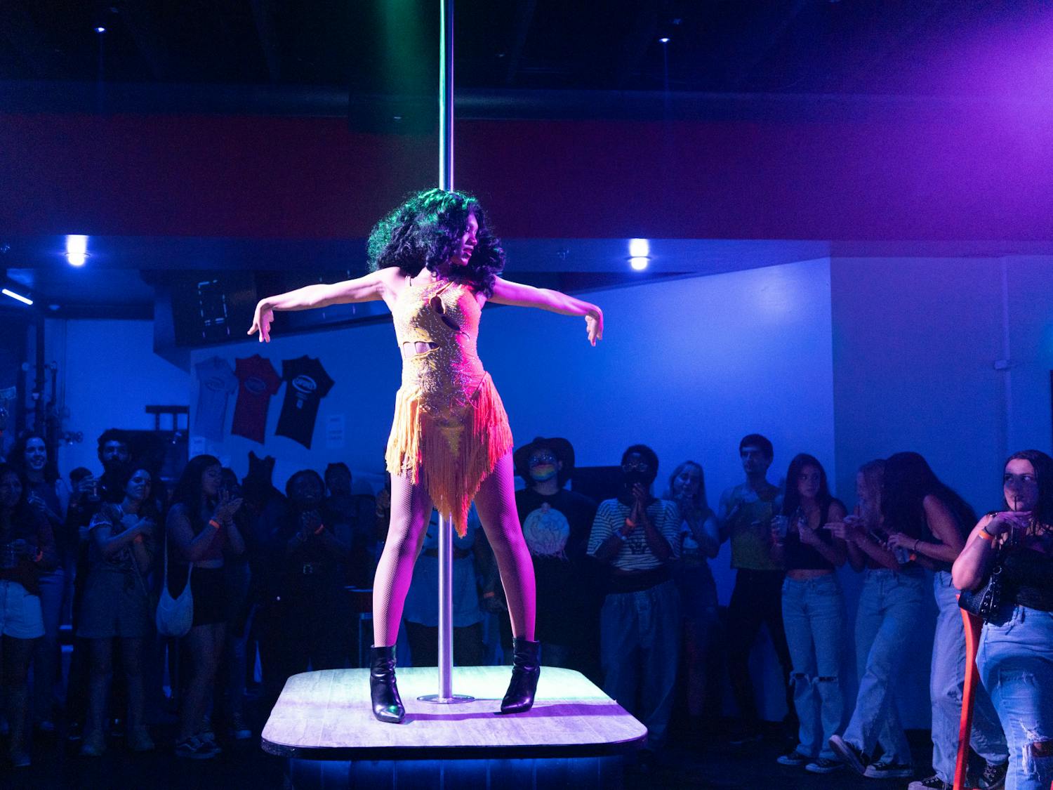 A drag queen performs as a crowd looks on at Capones on Friday, July 5, 2024.