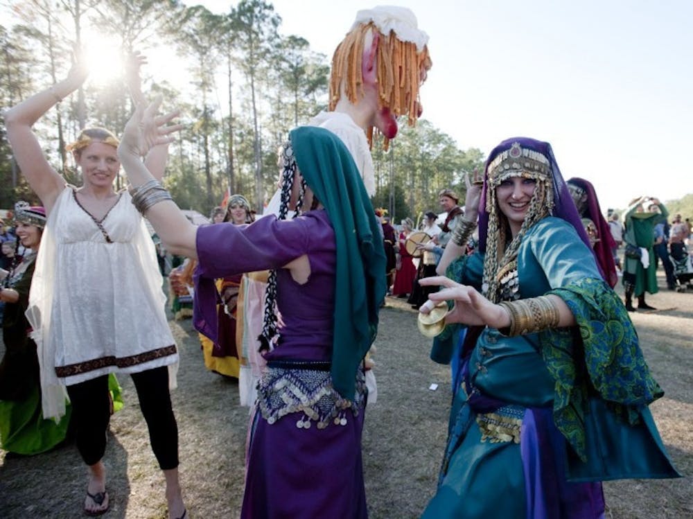 <p>Gypsies dance at the Hoggetowne Medieval Fair on Saturday. The Alachua County Fairgrounds will be moving to a site two miles north of the Gainesville Regional Airport in a few years for a total cost of $24 million.</p>
