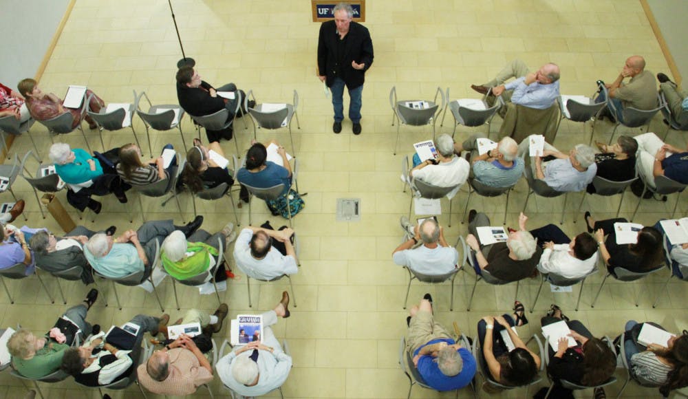 UF alumnus and St. Petersburg Times journalist Jeff Klinkenberg
speaks at Pugh Hall on Monday evening. He urged Floridians to
preserve their history.