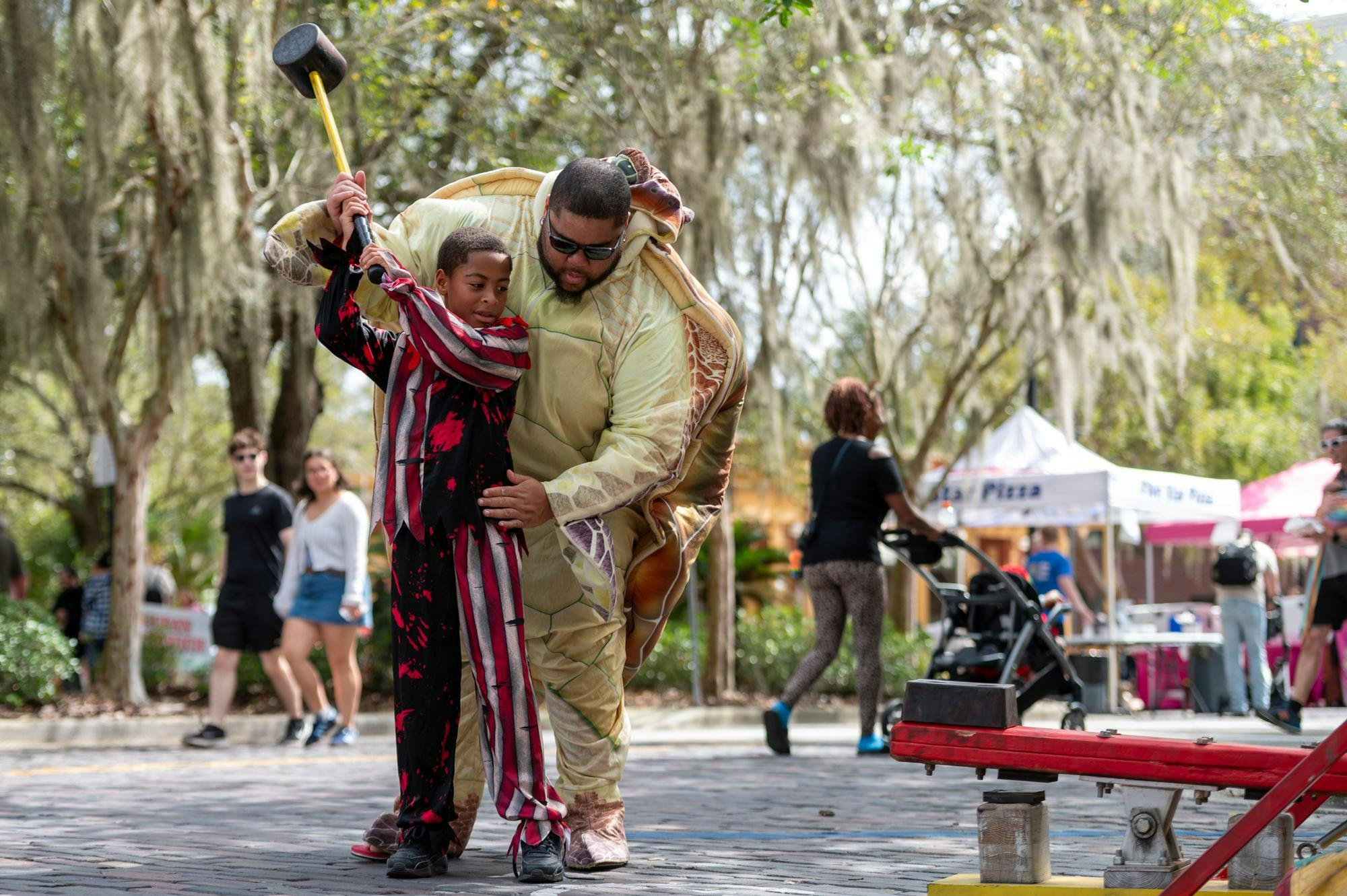 Gainesville families participate in the Fall Festivities at the first annual Great Pumpkin Bash at Bo Diddley Plaza in Fla. on Oct. 11, 2025.