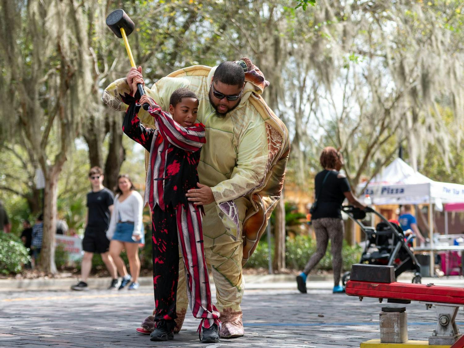 Gainesville families participate in the Fall Festivities at the first annual Great Pumpkin Bash at Bo Diddley Plaza in Fla. on Oct. 11, 2025.