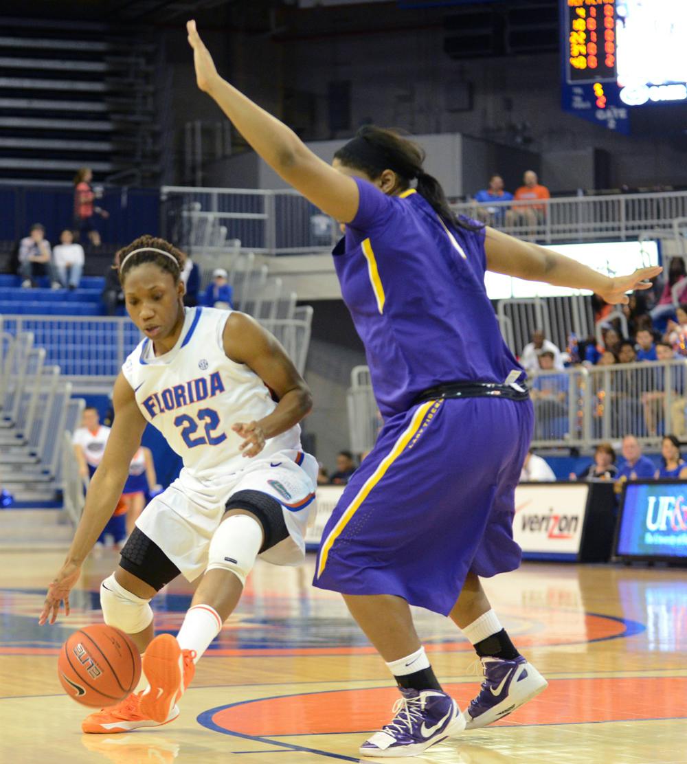 Guard Kayla Lewis (22) drives the lane during Florida’s 77-72 win against LSU on Sunday in the O’Connell Center.