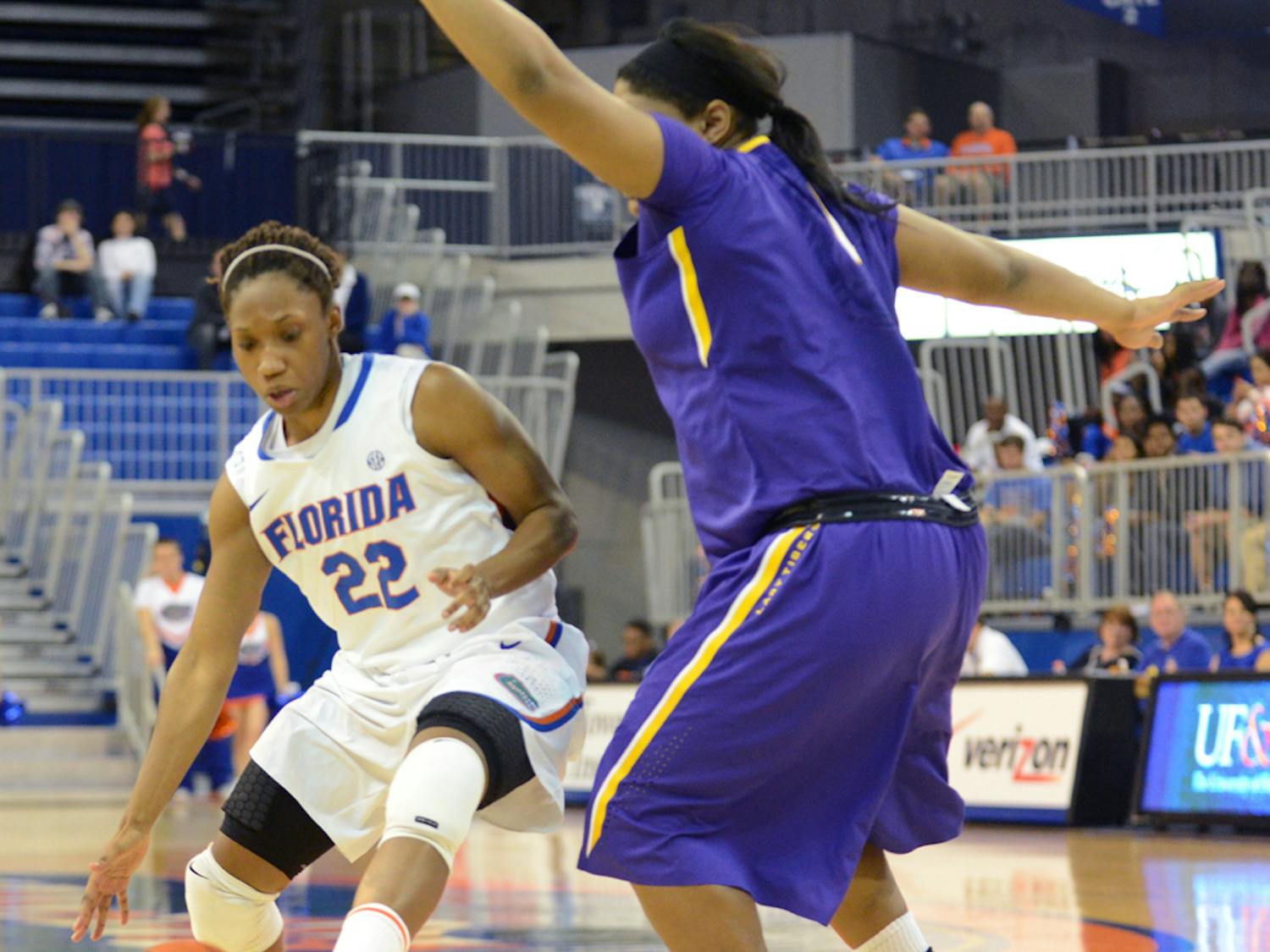 Guard Kayla Lewis (22) drives the lane during Florida’s 77-72 win against LSU on Sunday in the O’Connell Center.