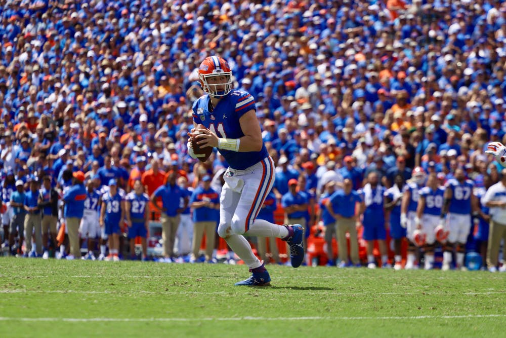 Quarterback Kyle Trask drops back in front of a packed crowd against Tennessee last season. This year, most SEC schools will cap their stadium capacities at about 20 to 25 percent.