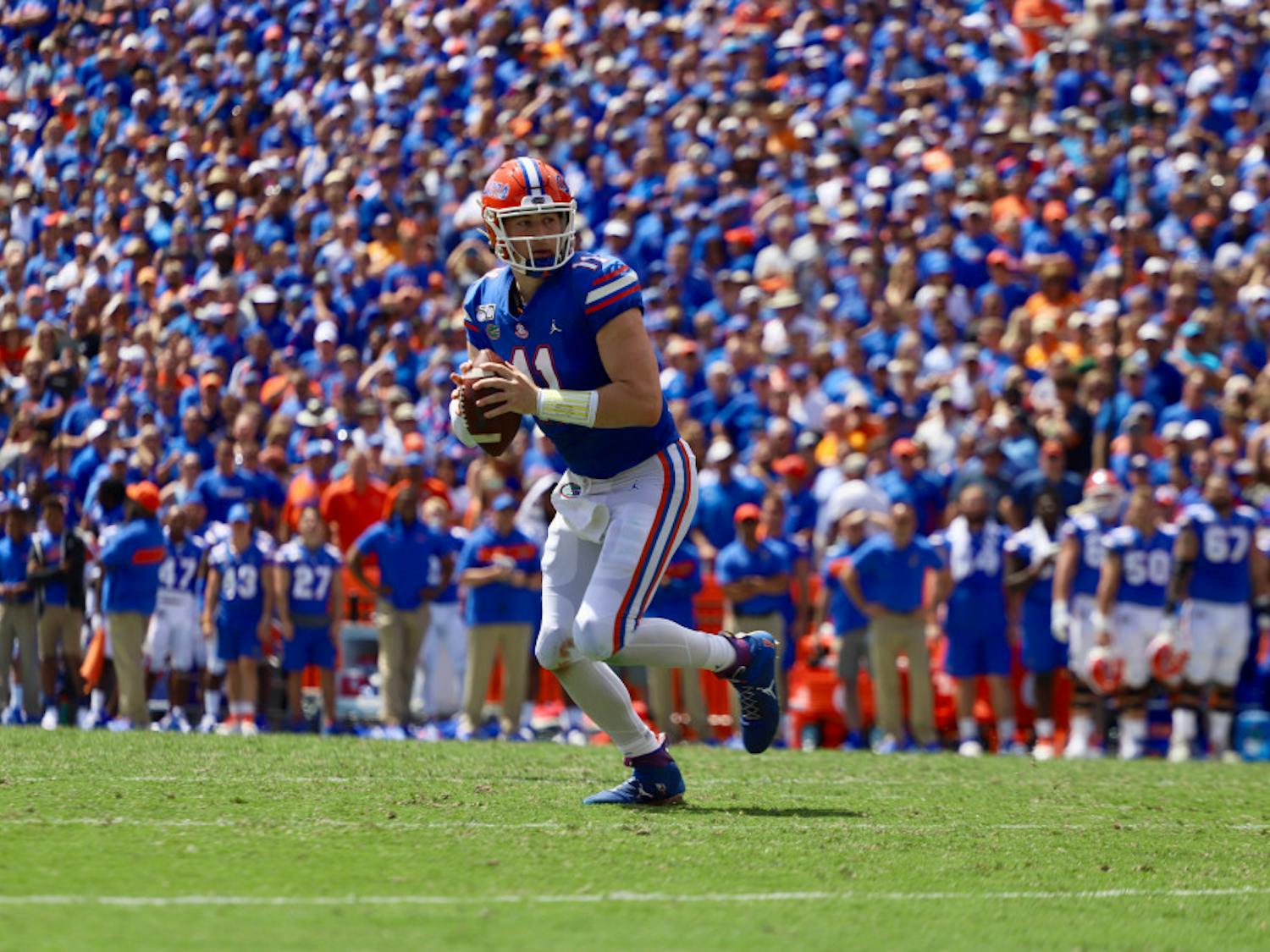 Quarterback Kyle Trask drops back in front of a packed crowd against Tennessee last season. This year, most SEC schools will cap their stadium capacities at about 20 to 25 percent.