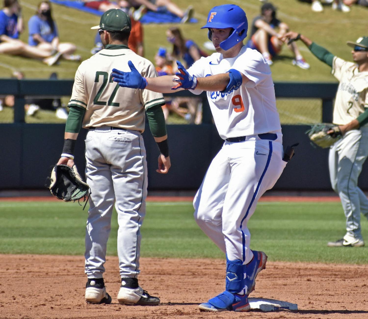 Catcher Mac Guscette gestures towards his dugout from second base. He cracked his fourth homerun of the year Saturday.