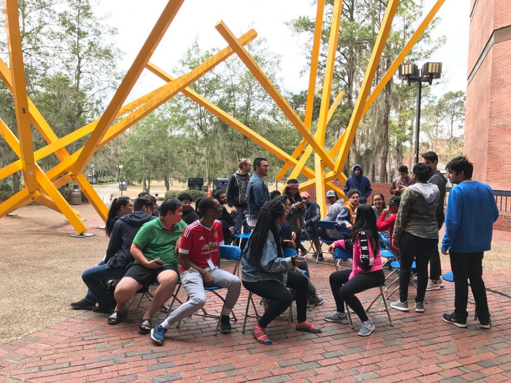 Students play musical chairs during a break from a 36-hour hackathon this weekend. The fourth annual SwampHacks, which started on Friday, brought 532 tech-savvy students from schools around the Southeast to Marston Science Library to create computer programs, win prizes and attend workshops.