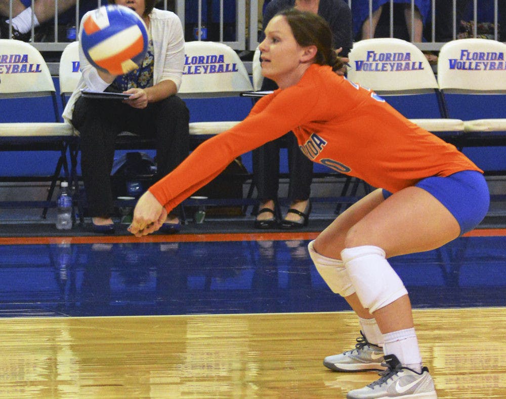 <p>Holly Pole squats for a dig attempt during Florida's 3-0 win against Georgia.</p>