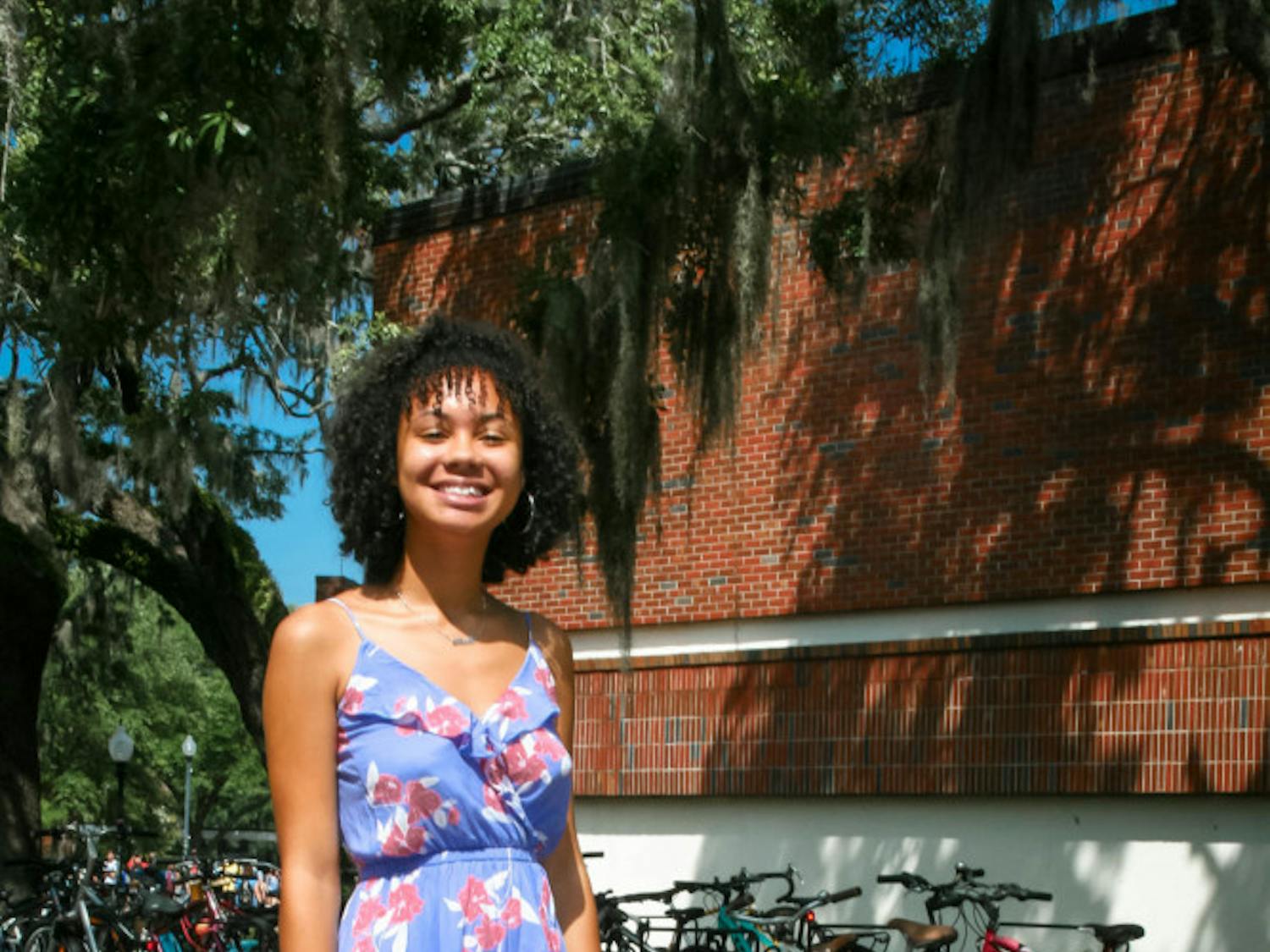 Keala Moncur, 17, donning a bright floral dress and chunky sneakers as she begins her first semester.