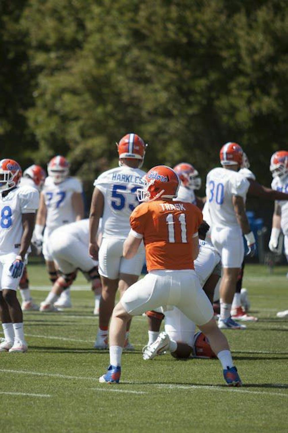 <p>UF quarterback Kyle Trask drops back to pass during a spring practice at the Sanders Practice Field on March 22, 2017.</p>