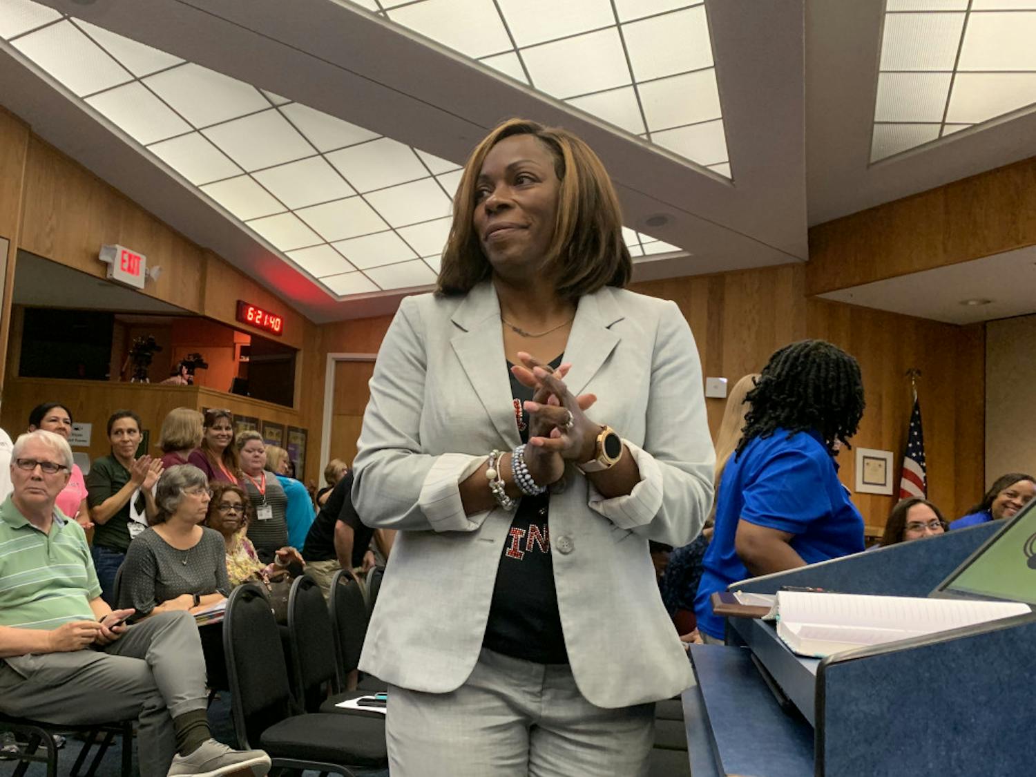 Natalie Strappy, executive director of the Alachua County School District’s Head Start program, invites employees, parents and members of the program to stand and be recognized during a proclamation at Tuesday’s school board meeting.