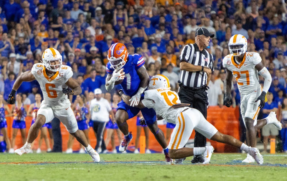 Sophomore running back Trevor Etienne is tackled by a Tennessee defender in the Gators' 29-16 win against the Tennessee Volunteers on Saturday, Sept. 16, 2023.
