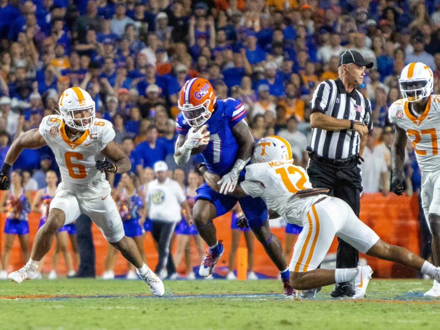 Sophomore running back Trevor Etienne is tackled by a Tennessee defender in the Gators' 29-16 win against the Tennessee Volunteers on Saturday, Sept. 16, 2023.