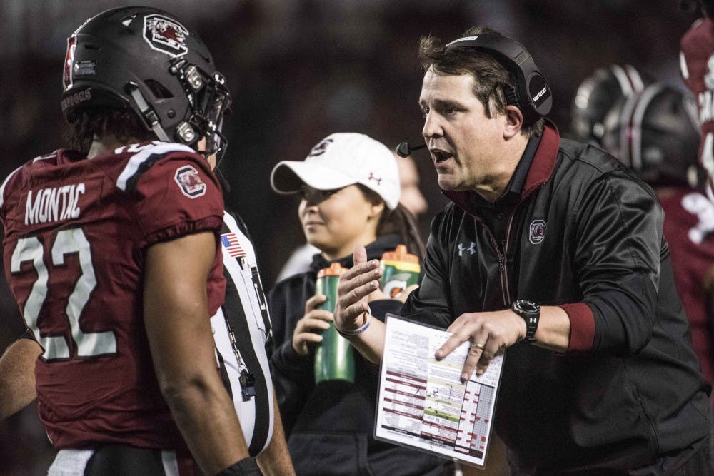 South Carolina head coach Will Muschamp, right, communicates with defensive back Steven Montac (22) during the second half of an NCAA college football game Saturday, Nov. 5, 2016, in Columbia, S.C. South Carolina defeated Missouri 31-21. (AP Photo/Sean Rayford)