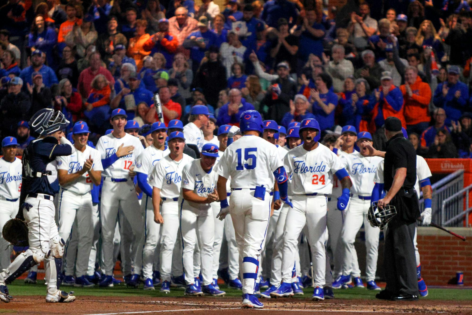 Florida catcher BT Riopelle celebrates his three-run home run with the Gators during their 13-3 win against the Charleston Southern Buccaneers Friday, Feb. 17, 2023.