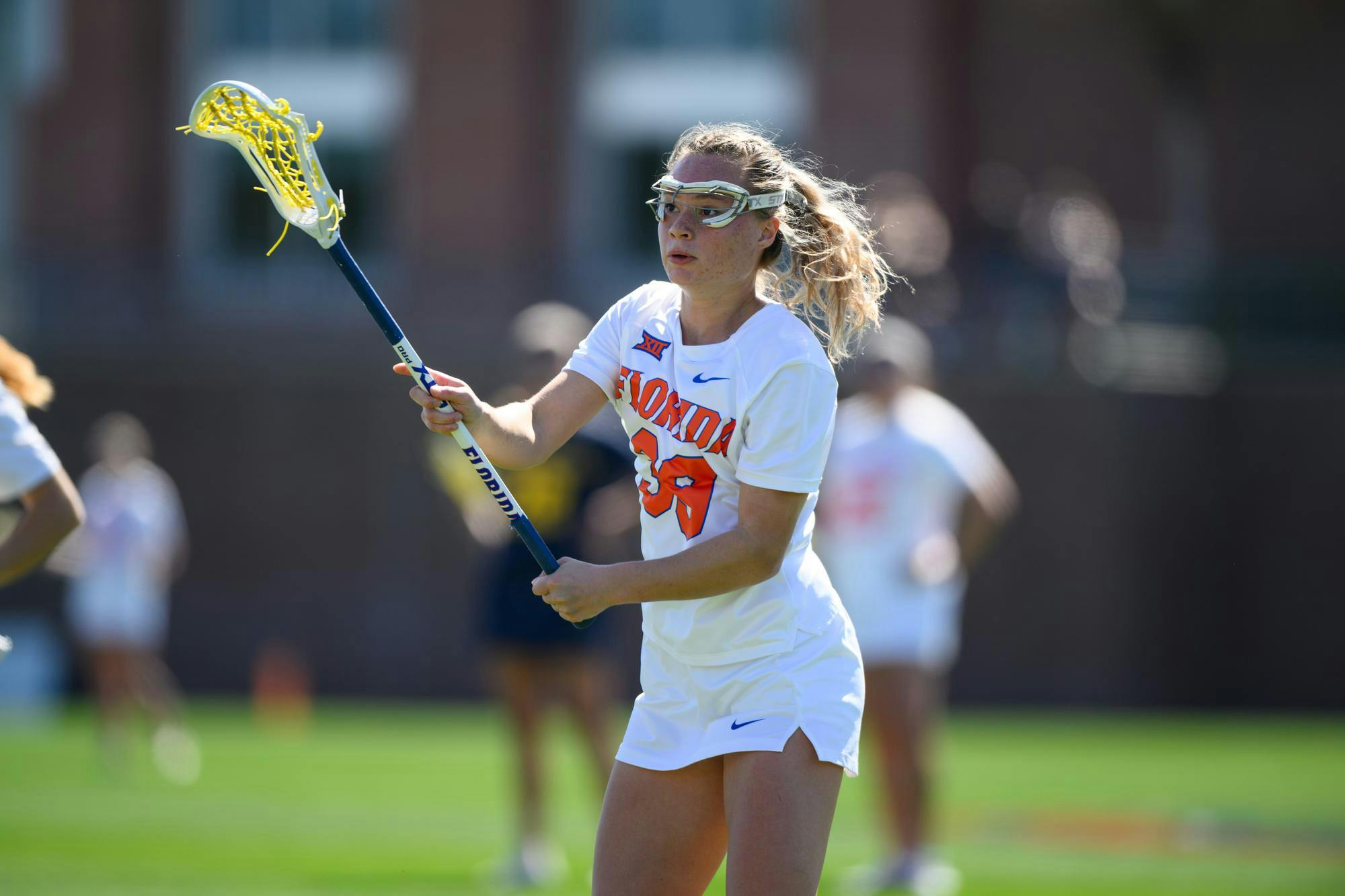 Florida attacker Ava Kristynik (39) passes during the first half of an NCAA lacrosse match against Michigan, Friday, Feb. 13, 2026, in Gainesville, Fla.
