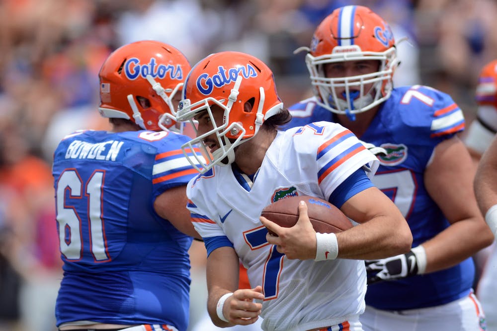 <p>Will Grier rushes during the Orange and Blue Debut on April 11, 2015, at Ben Hill Griffin Stadium.</p>