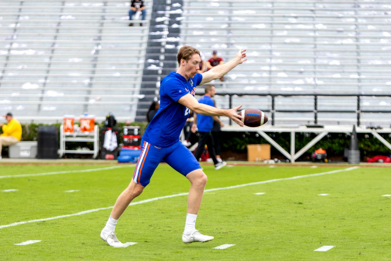 Junior punter Jeremy Crawshaw practices punting the ball before the Gators' game against the South Carolina Gamecocks on Saturday, Oct. 14, 2023.