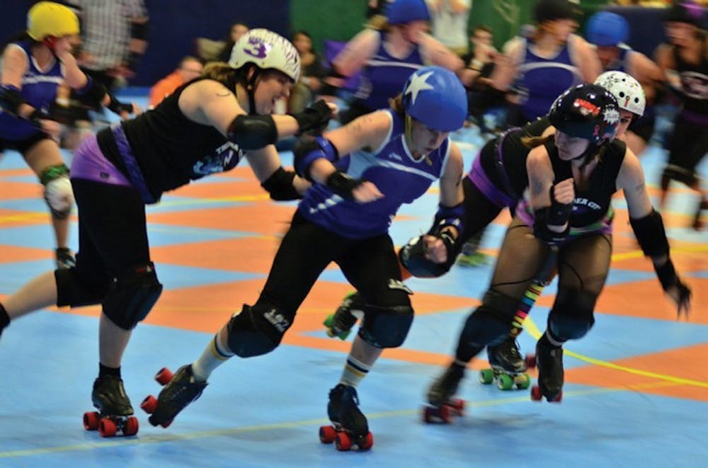 <p>LeBrawn Maimes of the Gainesville Roller Rebels secures lead jammer position in a jam against the Thunder City Derby Sirens on Oct. 23, 2011. The women's roller derby league has been picked to join a national skating apprenticeship program.</p>