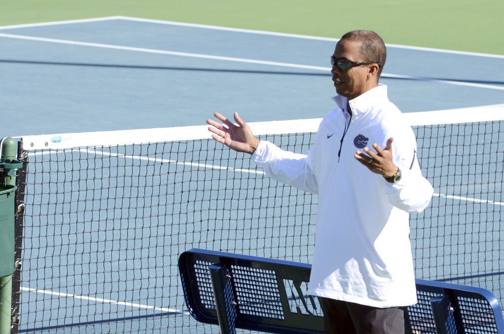 <p>UF men's tennis coach Bryan Shelton reacts during Florida's 9-3 win against William &amp; Mary on Jan. 10, 2015 at the Ring Tennis Complex.</p>