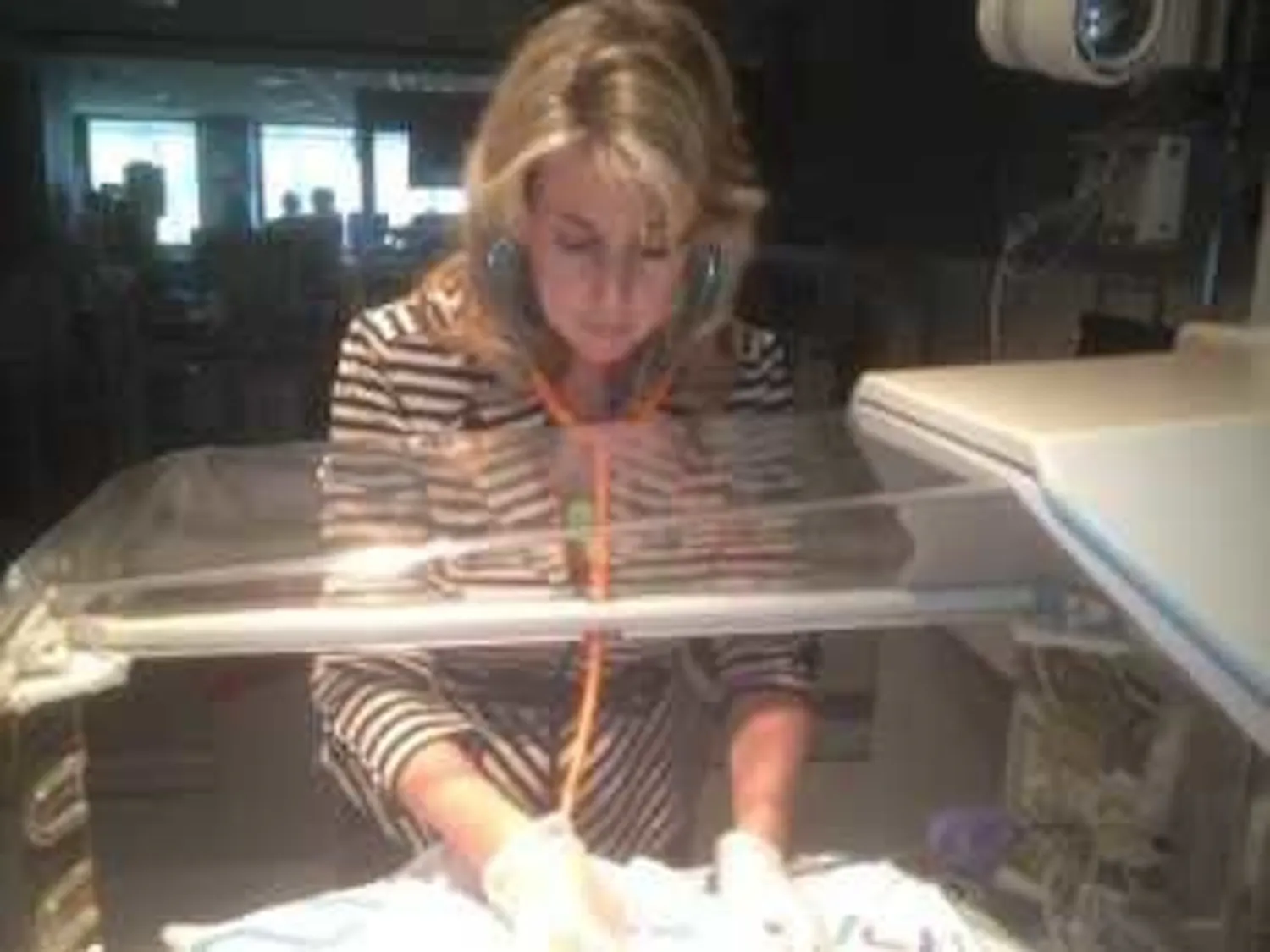 Dr. Leslie Parker examines a premature infant in the NICU at UF Health Shands Hospital. 