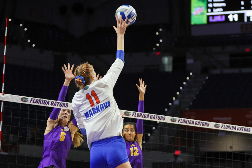 UF senior outside hitter Marina Markova rises above the net for a spike against the LSU Tigers Sunday, Oct. 9, 2022. 