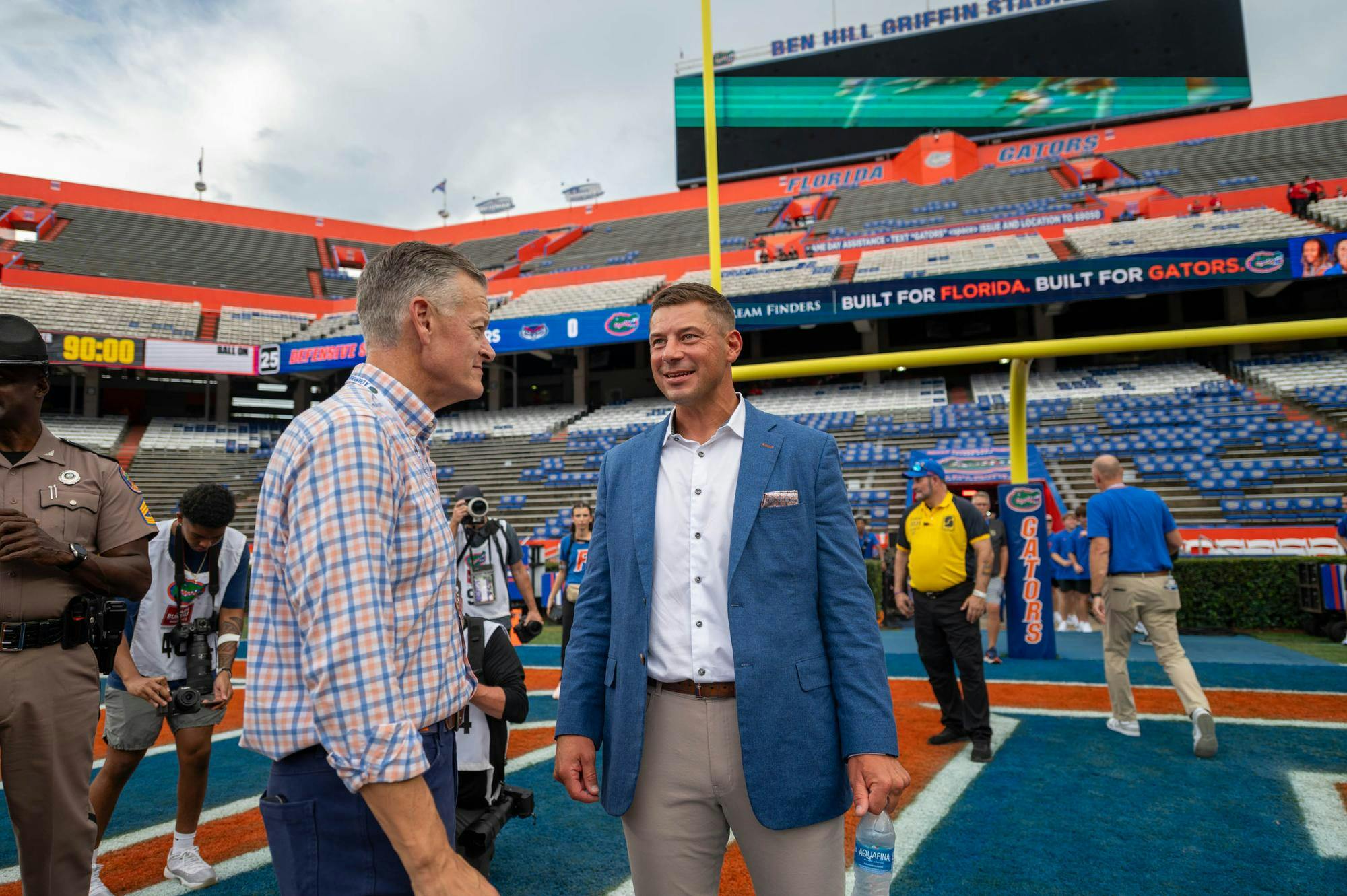 Florida head coach Jon Sumrall speaks with Florida athletic director Scott Stricklin before an NCAA college football game against FAU, Saturday, Sept. 5, 2026, in Gainesville, Fla.