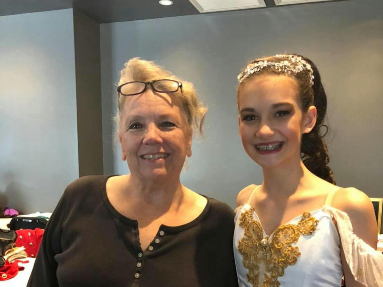 Pofahl Dance Studio co-founder, Kim Tuttle, poses with Kelly Christie’s daughter, Mia, after a performance of The Nutcracker.