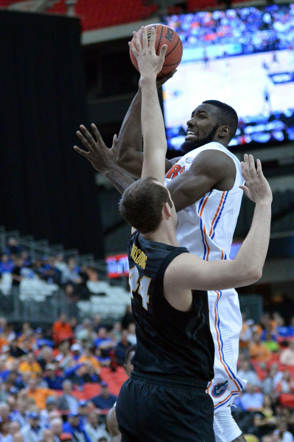 <p>Patric Young attempts a shot during Florida’s 72-49 win against Missouri on March 14 in the Georgia Dome in Atlanta during the Southeastern Conference Tournament. Young was the 2014 SEC Defensive Player of the Year and averaged 6.4 rebounds per game on the season.</p>