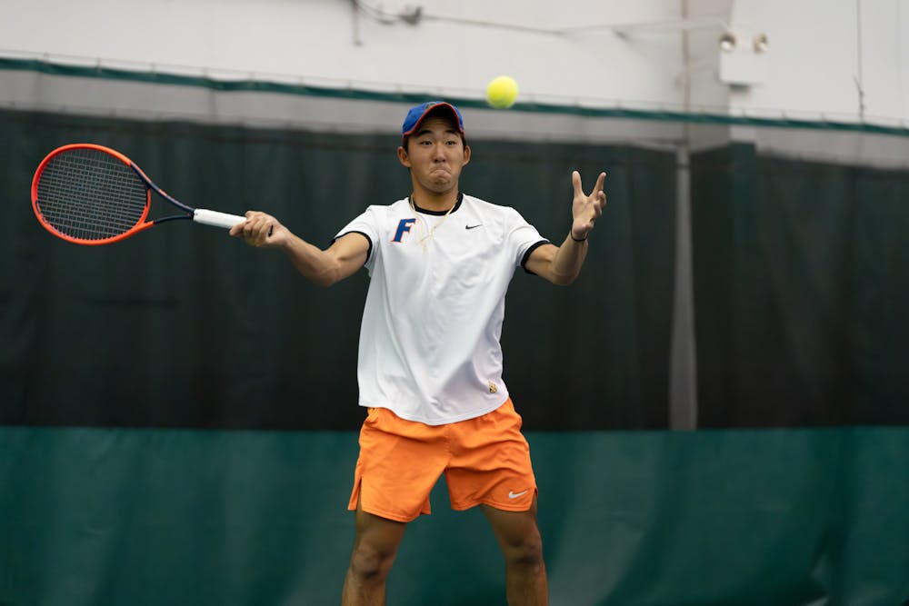 <p>Gator tennis player Jeremy Jin keeps his eye on the ball against Ole Miss on Friday, March 22, 2024. </p>