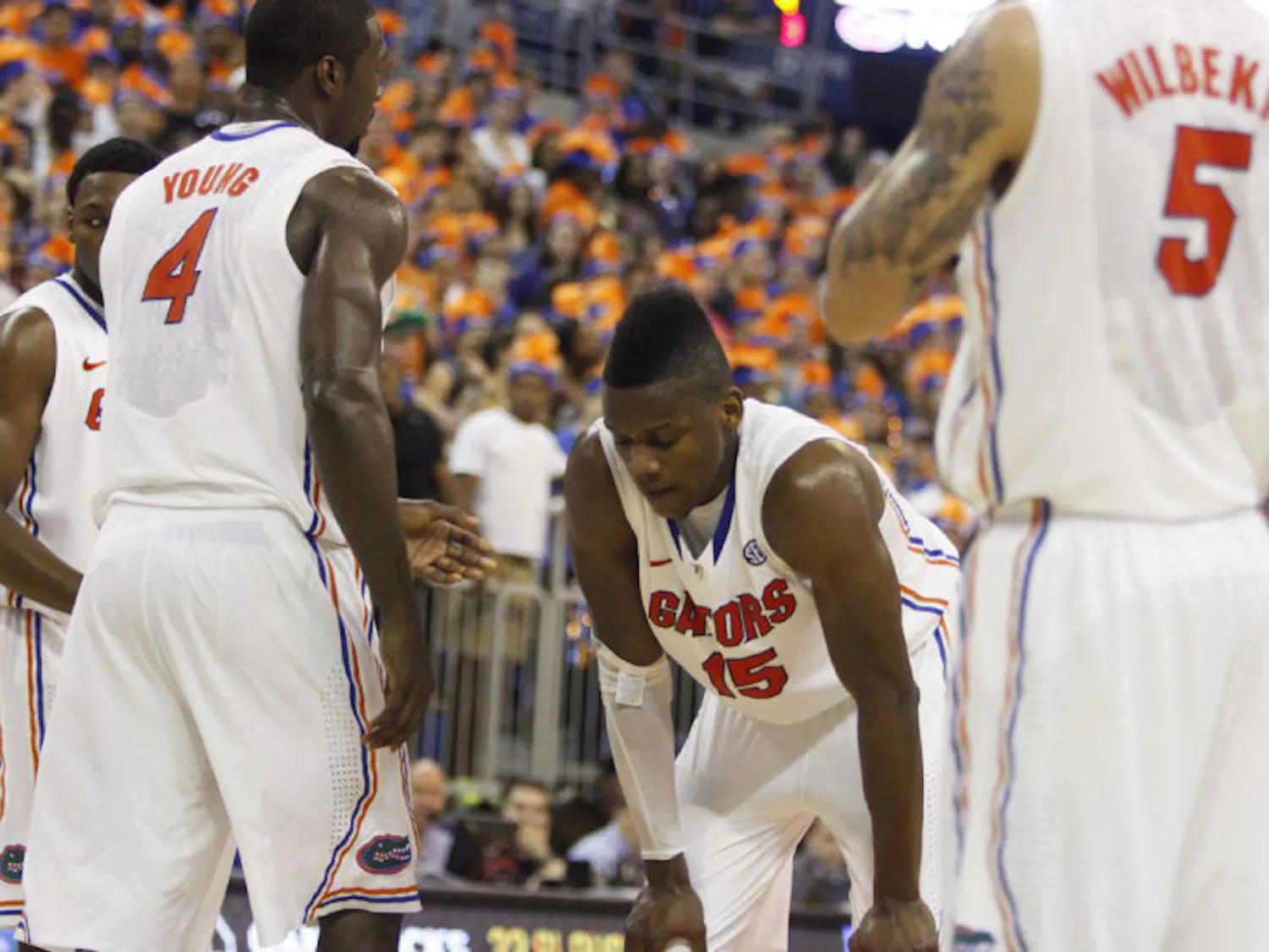 Junior forward Will Yeguete (15) rests with his hands on his knees during Florida’s 75-36 win against South Carolina on Jan. 30 in the O’Connell Center.