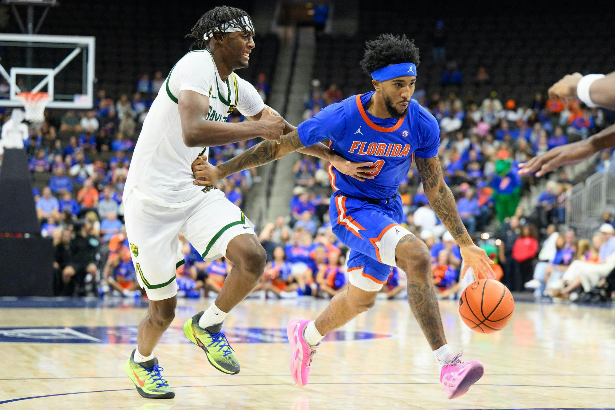Florida guard Boogie Fland (0) drives during the first half of an NCAA men's basketball exhibition game against Baylor, Sunday, Oct. 18, 2026, in Jacksonville, Fla.