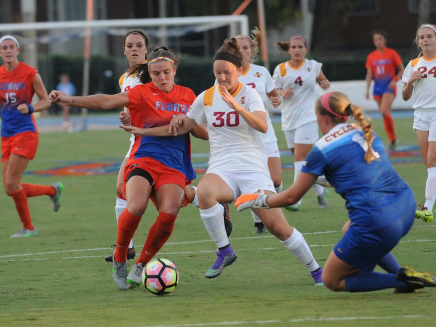 UF forward Savannah Jordan fights for possession during Florida's 5-2 win against Iowa State on Aug. 19, 2016, at James G. Pressly Stadium.