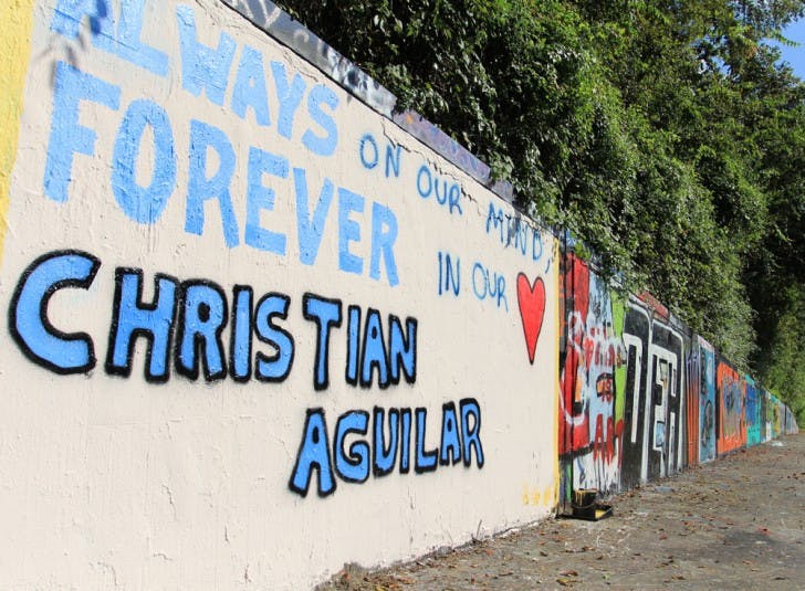 Supporters of the Aguilar family painted a memorial to Christian Aguilar on the 34th Street Wall on Saturday afternoon.