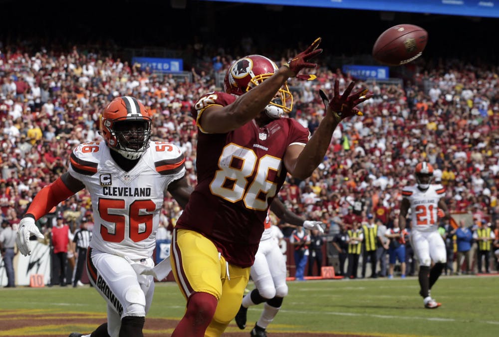 Washington Redskins tight end Jordan Reed (86) catches a touchdown pass in front of Cleveland Browns inside linebacker Demario Davis (56) during the first half of an NFL football game Sunday, Oct. 2, 2016, in Landover, Md. (AP Photo/Chuck Burton)