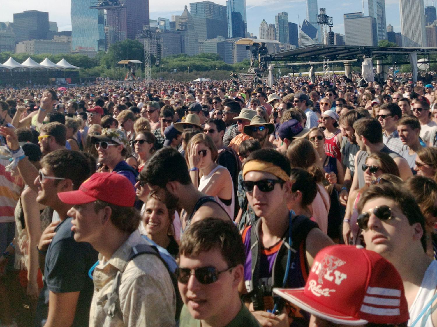 A crowd of Lollapalooza festival-goers wait for the next act to grace the stage in Grant Park in Chicago. The three-day festival will be held Aug. 1 to 3.