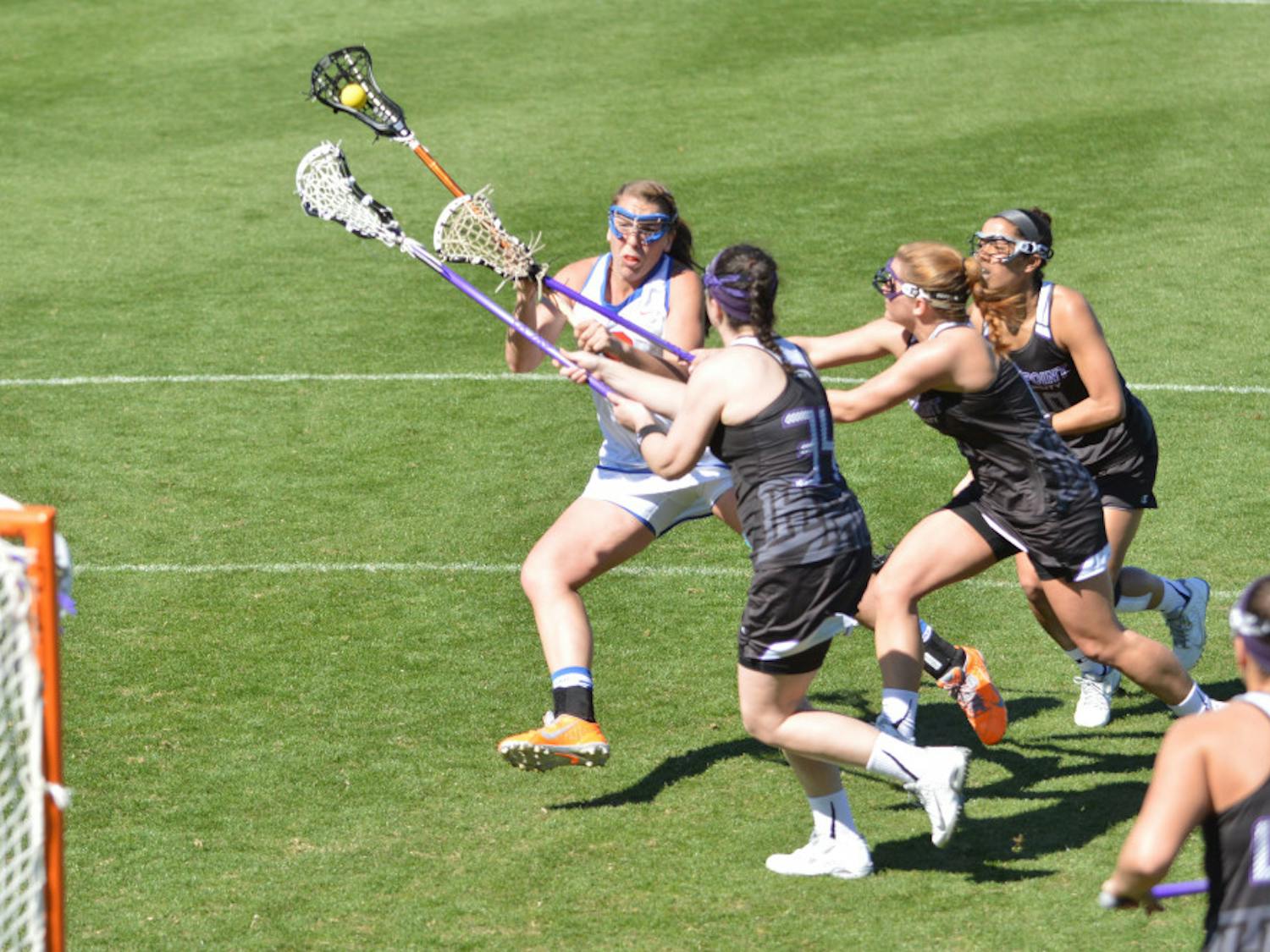 Shannon Gilroy attempts a shot during Florida's 18-7 win against High Point on Saturday in Donald R. Dizney Stadium. The junior midfielder set UF single-game records for draw controls (10), goals (8) and shots (13) against the Panthers.
