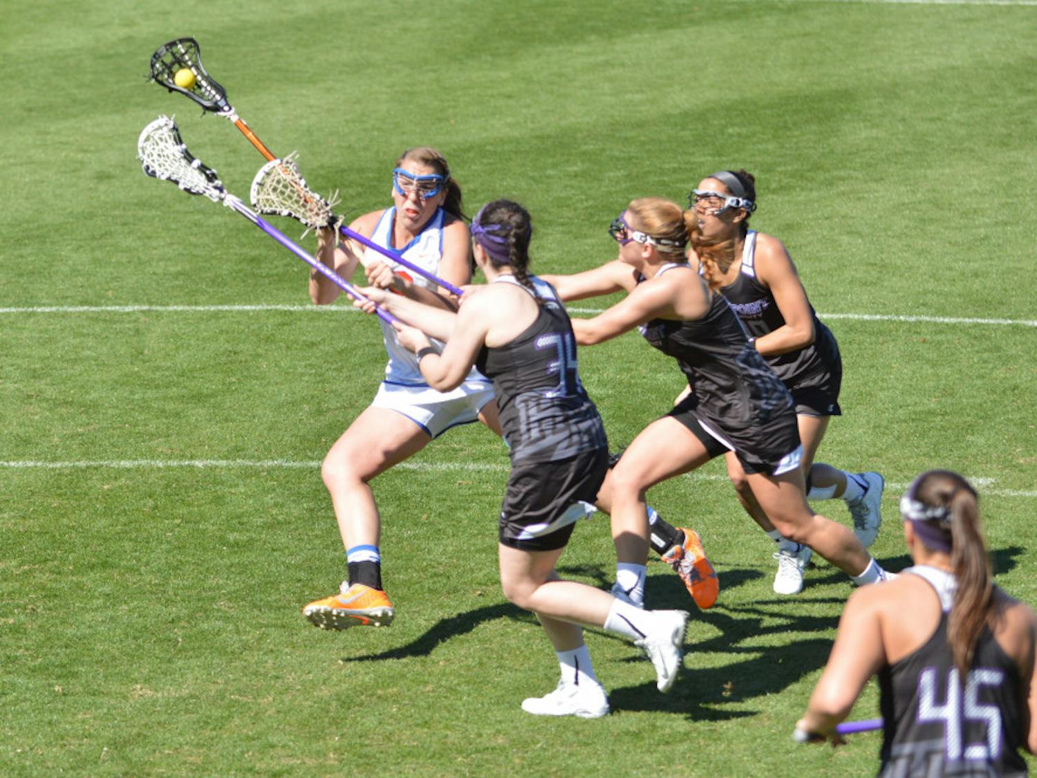 Shannon Gilroy attempts a shot during Florida's 18-7 win against High Point on Saturday in Donald R. Dizney Stadium. The junior midfielder set UF single-game records for draw controls (10), goals (8) and shots (13) against the Panthers.