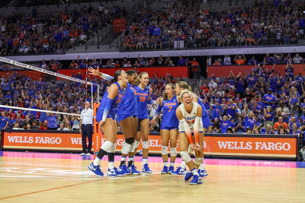 The Gators celebrate after winning a point in UF's 3-2 loss against the Wisconsin Badgers Sunday, Sept. 17, 2023.