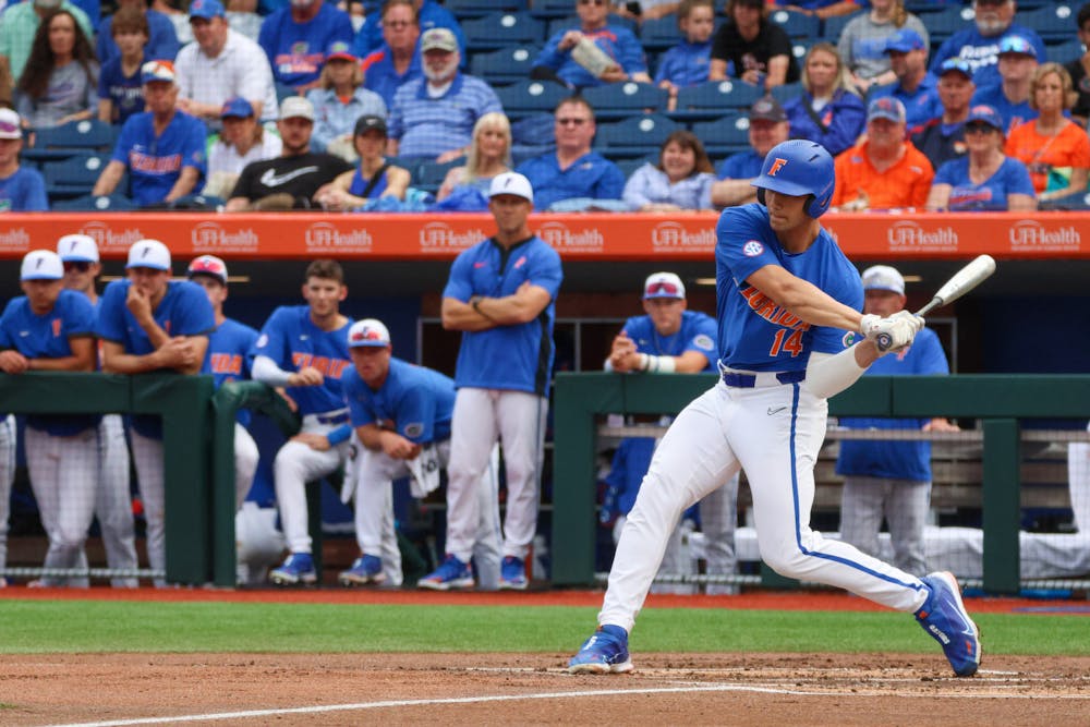 Gators designated hitter Jac Caglianone swings the bat against the Miami Hurricanes in an 14-6 defeat Saturday, March 4, 2023. 